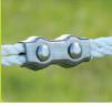 Close-up of a electric fence rope connector on a blurred background
