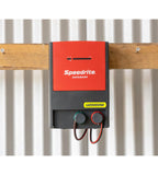 Speedrite U20000W electric Fence Unigizer mounted on barn wall at cattle farm and connected to electric fencing