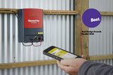 Speedrite 46000W AC/Mains Energizer with cell phone app in hand of rancher inside of barn