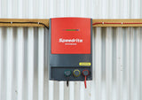 Speedrite 46000W electric fence Energizer mounted on a barn wall and connected to a electric fence