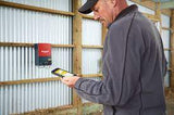 Cattle Farmer controlling his SPEEDRITE 86000W with Remote / Fault Finder while inside a barn